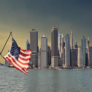 This photo features the American flag in combination with American landmarks